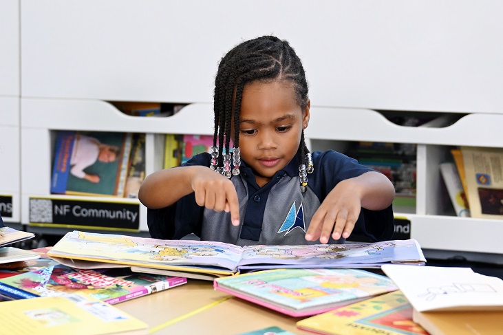 preK student with books