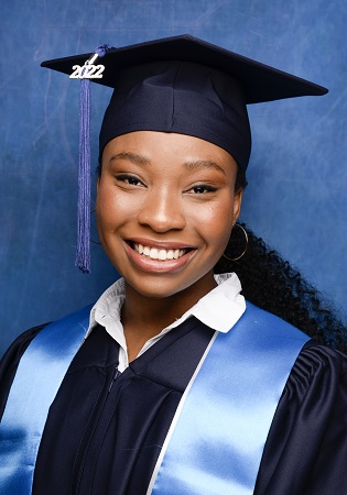 student with cap and gown